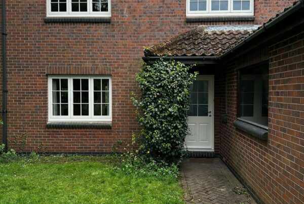 new cream coloured casement windows on a red brick home