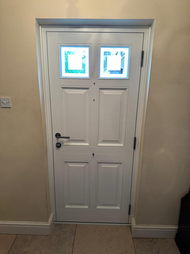 an internal shot of a white front door