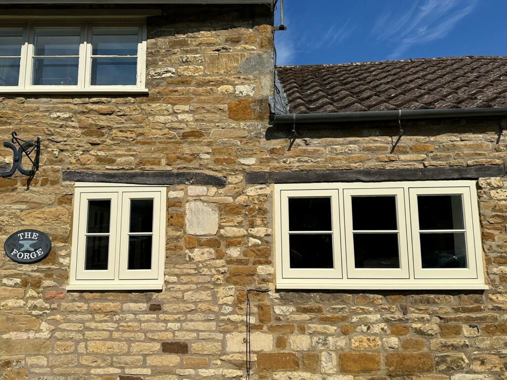 cream coloured casement windows on a stone building