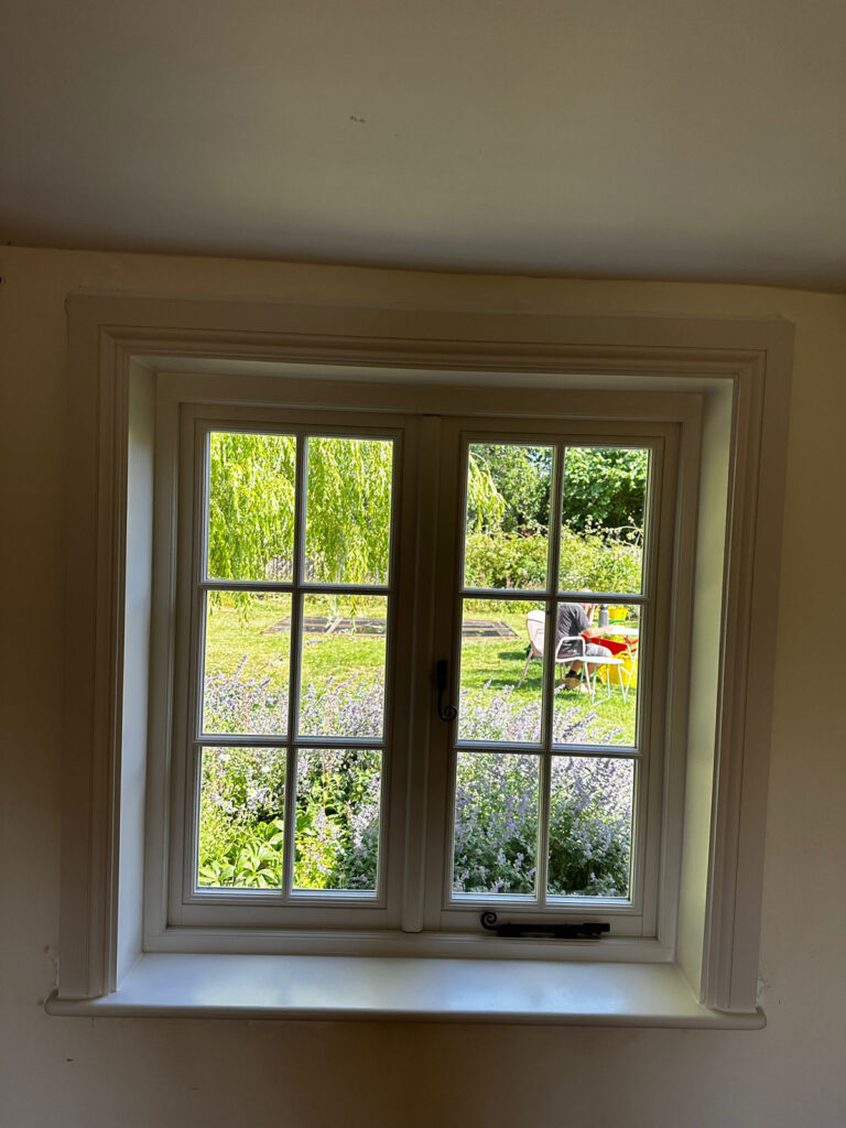 a dark room with casement windows