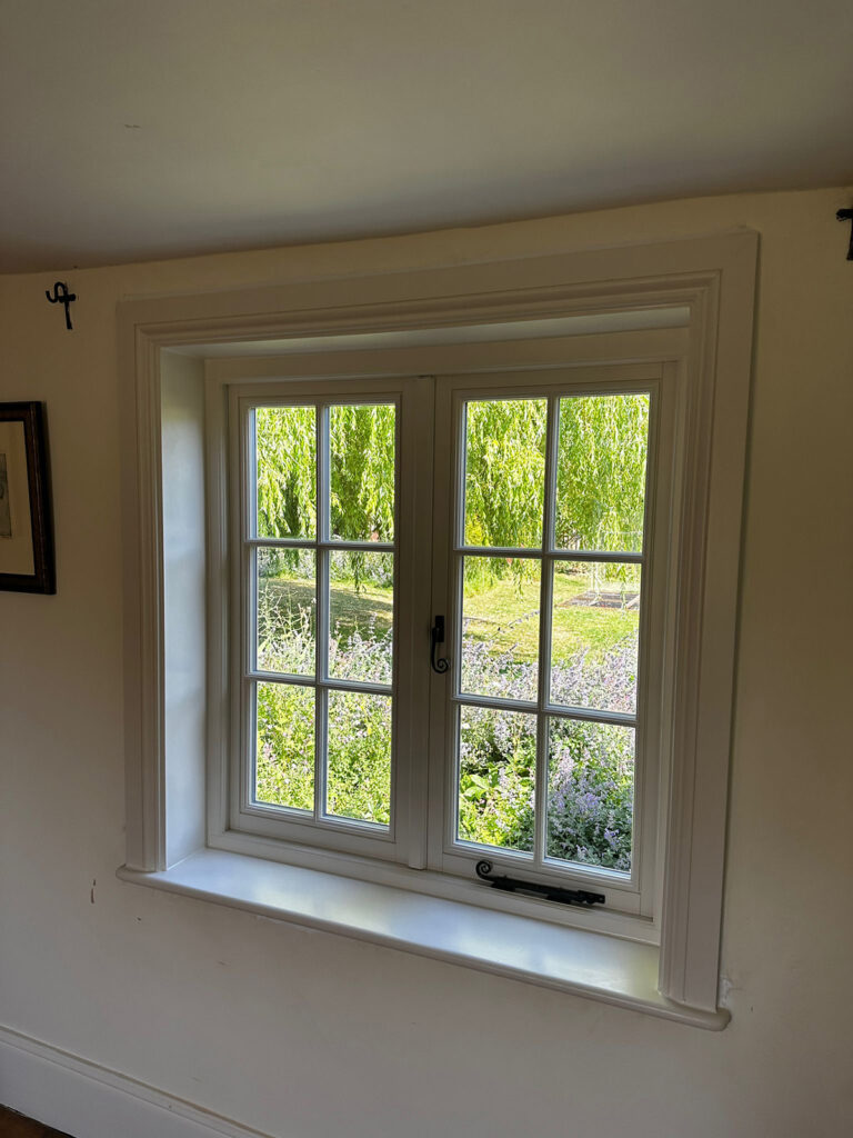 a dark room with casement windows