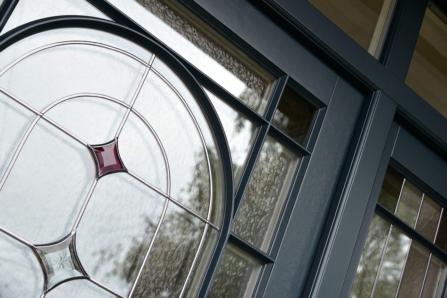 a close up of a timber front door with stained glass