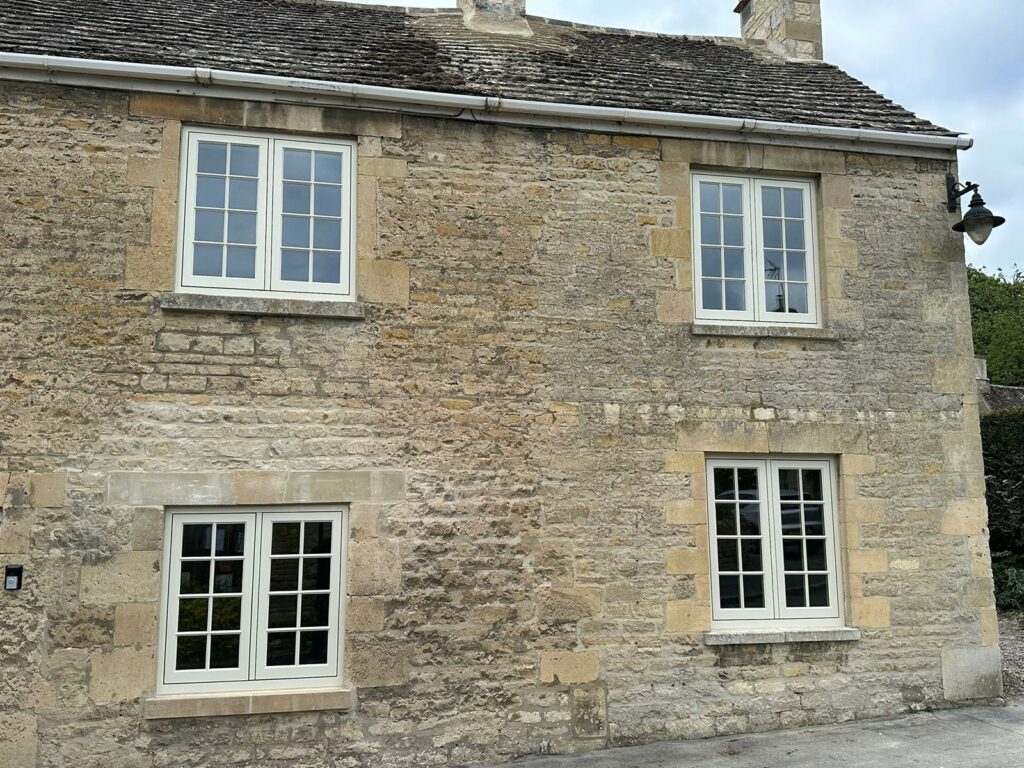 4 georgian casement windows on a stone building