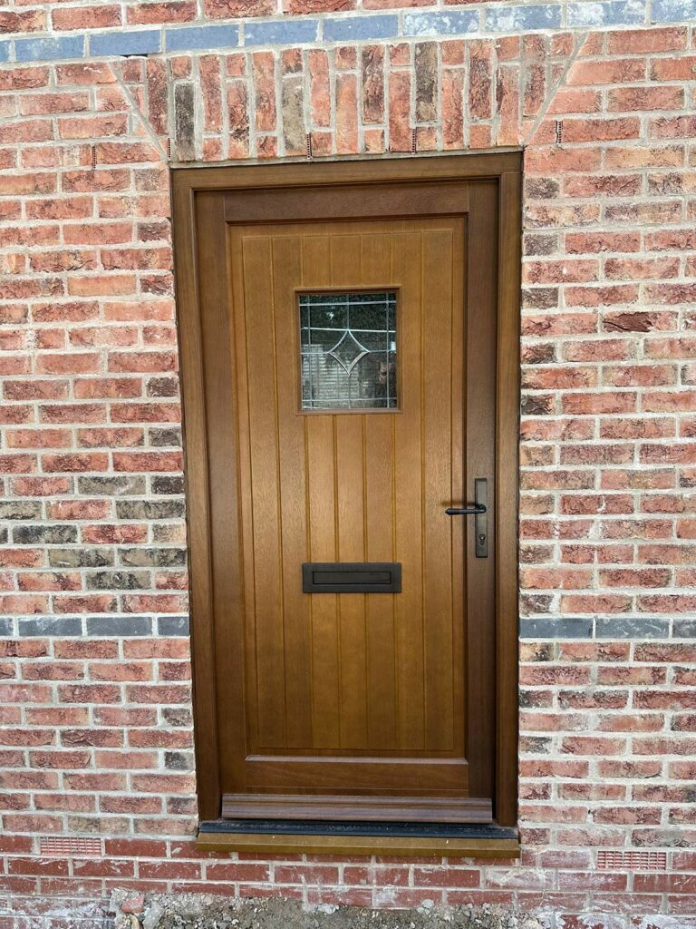 a dark oak stained timber front door