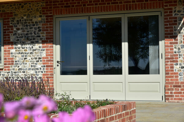 bifold doors with 3 leaves on a stone property