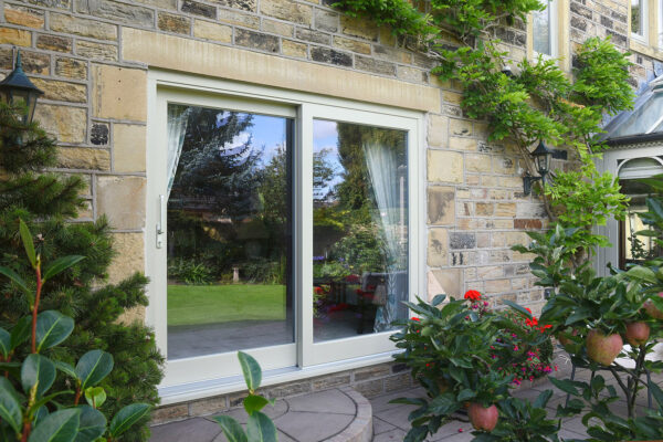 a closed set of sliding doors on a yorkshire stone property