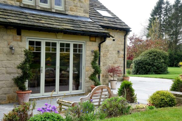 french grey bifold doors in front of a picnic bench