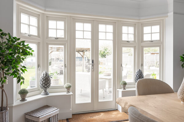 a striking of french doors with casement windows in a dining room