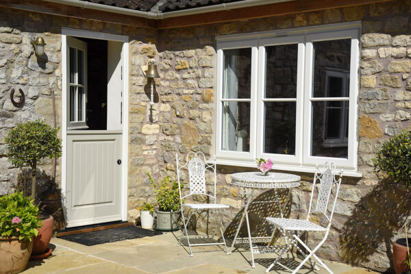a timber stable door and set of stormproof windows