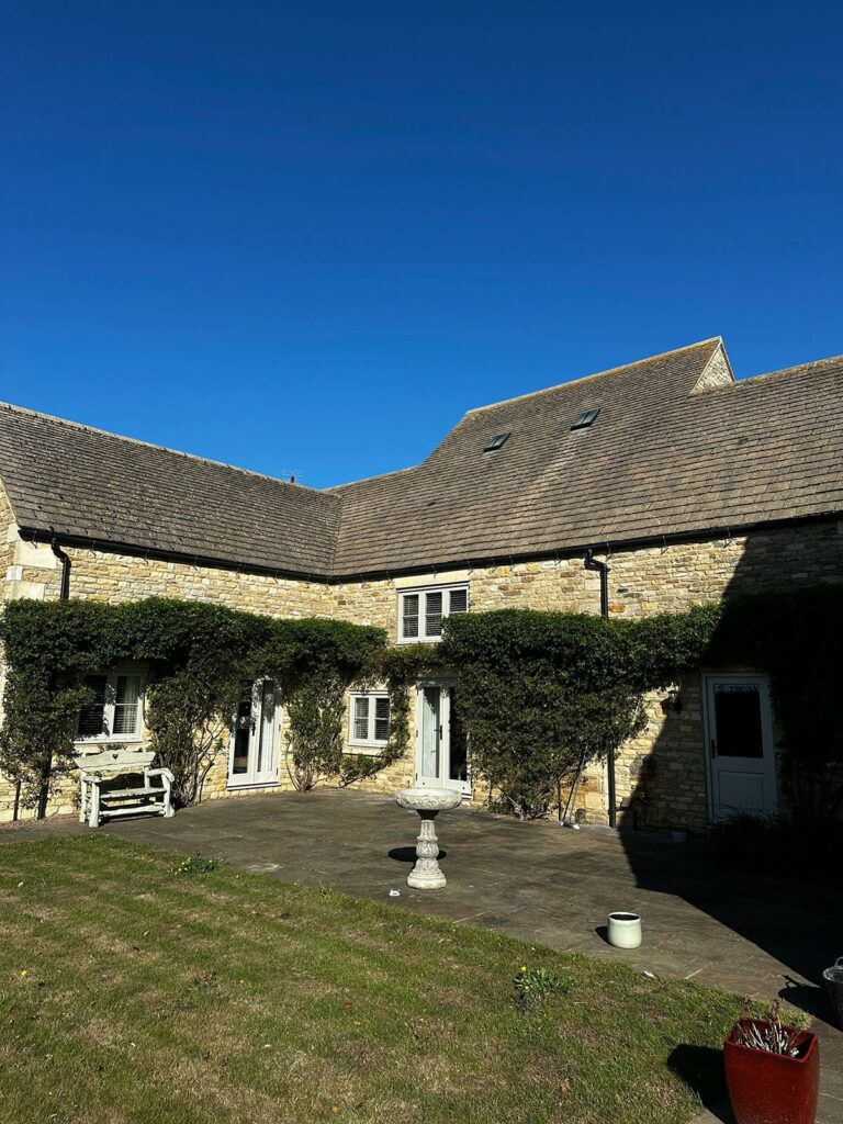 a stone house with a large open courtyard