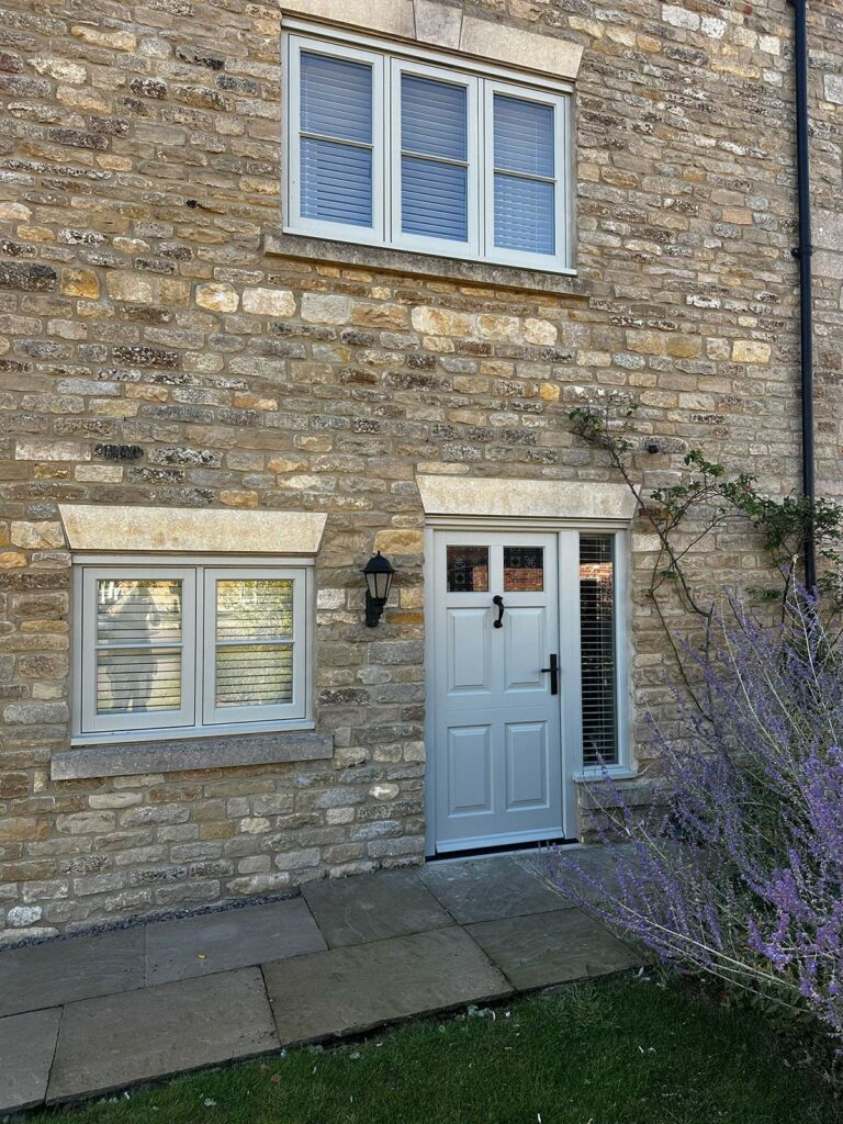a new front door with a set of casement windows alongside