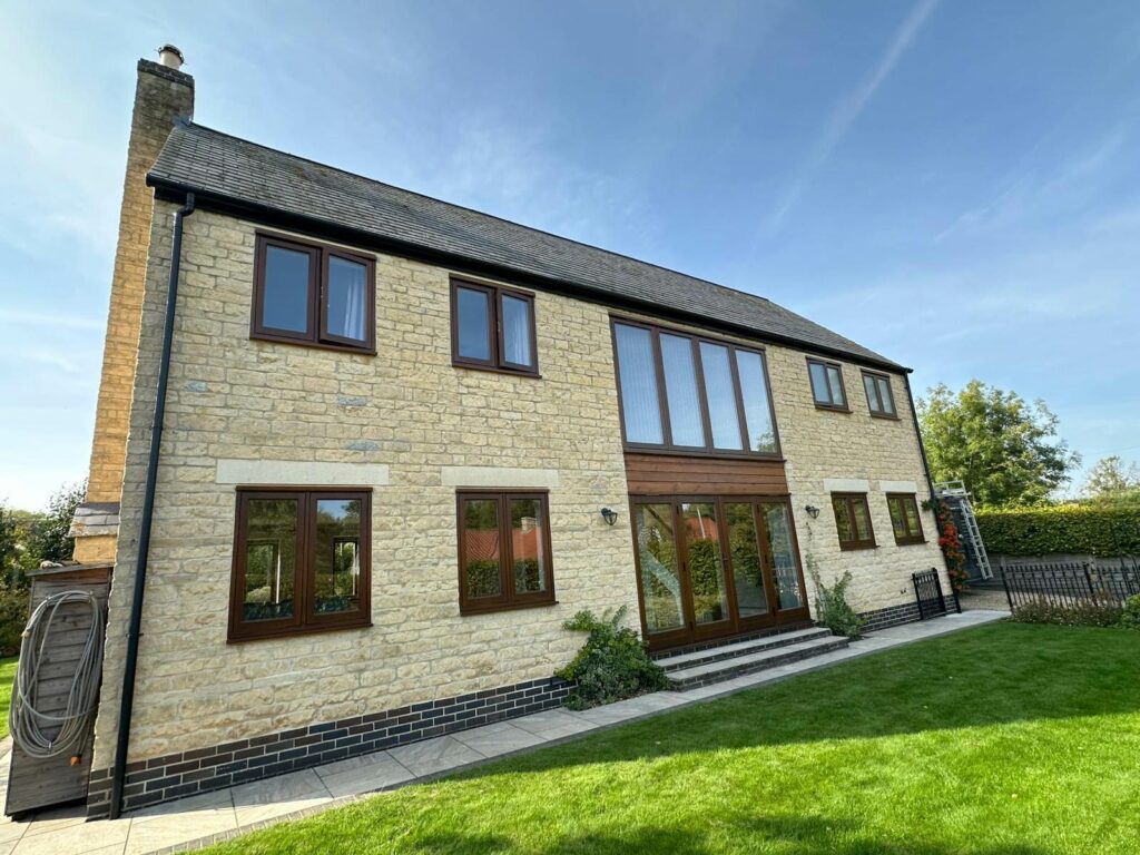 cyprys stained timber windows on a stained property