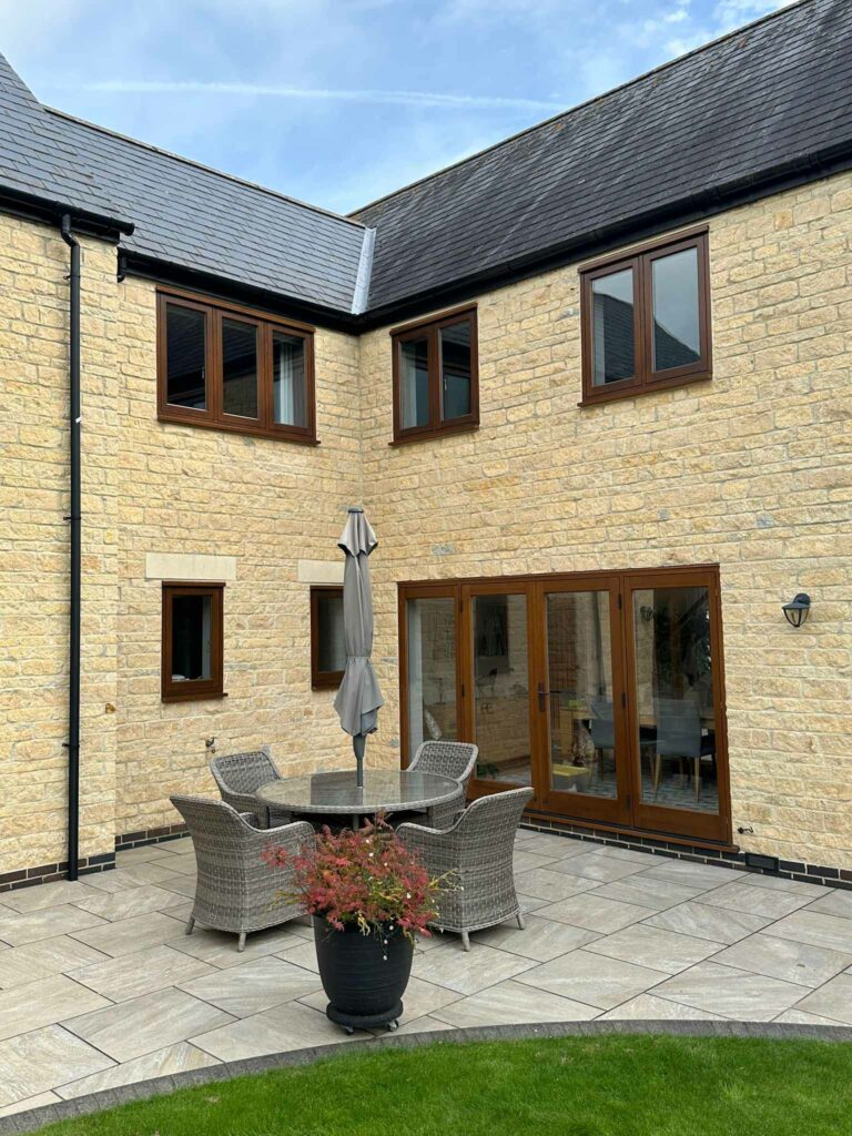 cyprys stained timber windows on a stained property