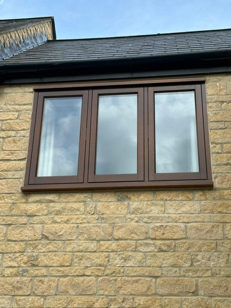 cyprys stained timber windows on a stained property