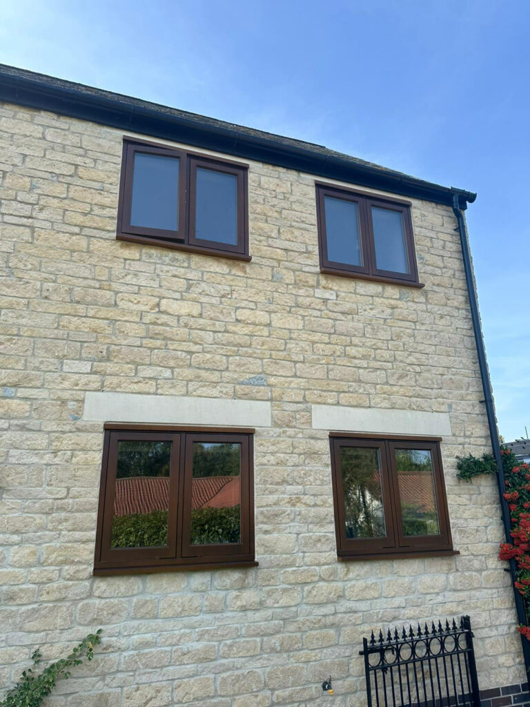 cyprys stained timber windows on a stained property