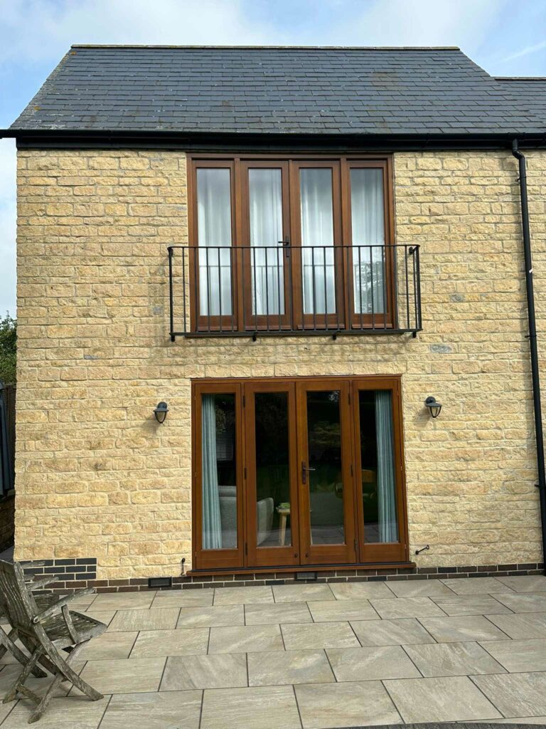 cyprys stained timber windows on a stained property