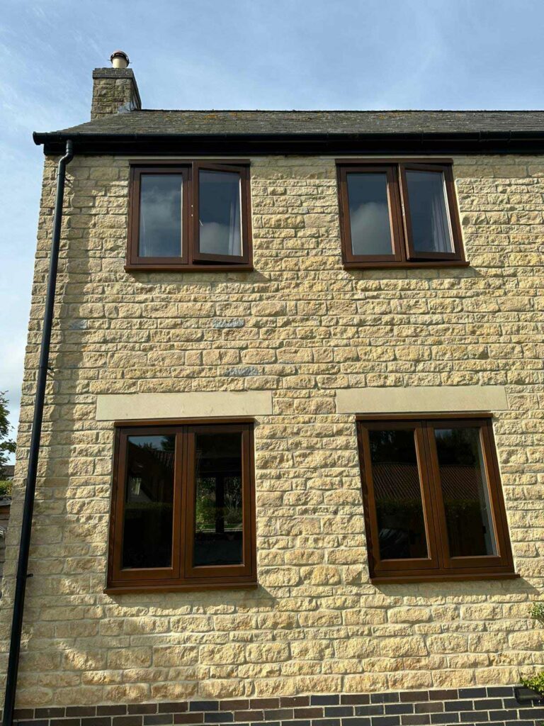 cyprys stained timber windows on a stained property