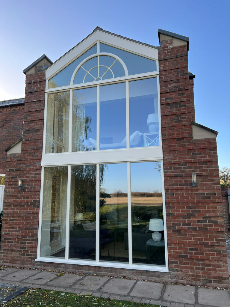 a feature set of fixed arched windows on a property
