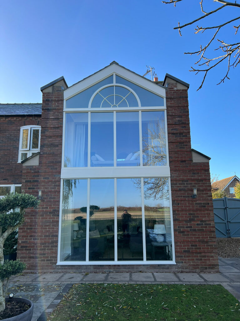 a feature set of fixed arched windows on a property