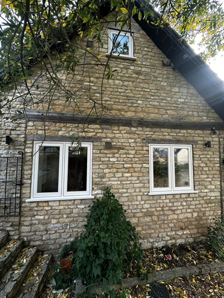 two sets of fully glazed casement windows