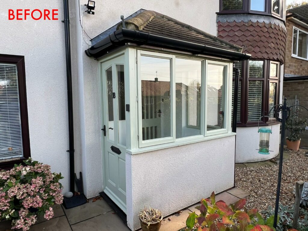 the porch of a house with a victorian style front door and lipped casement windows