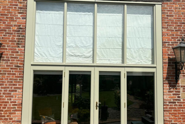 a large set of fully glazed french doors with oversized toplights