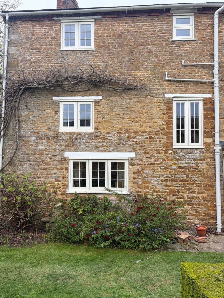 white windows with georgian bars on the side of a house