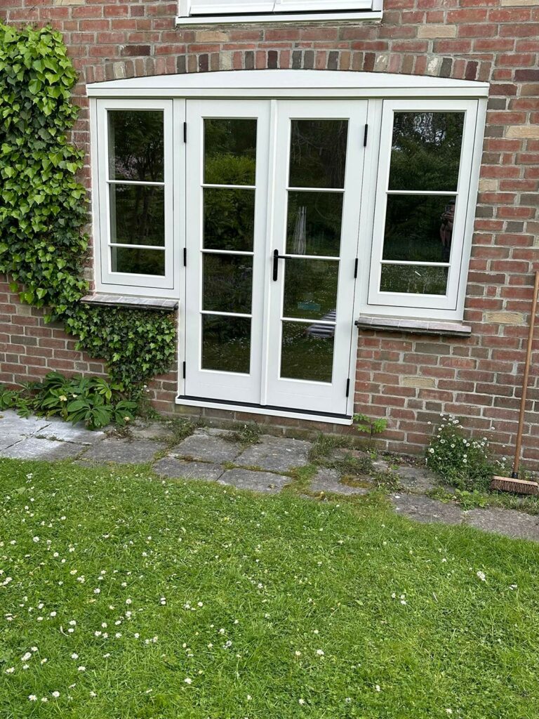 a set of french doors with casement flag windows